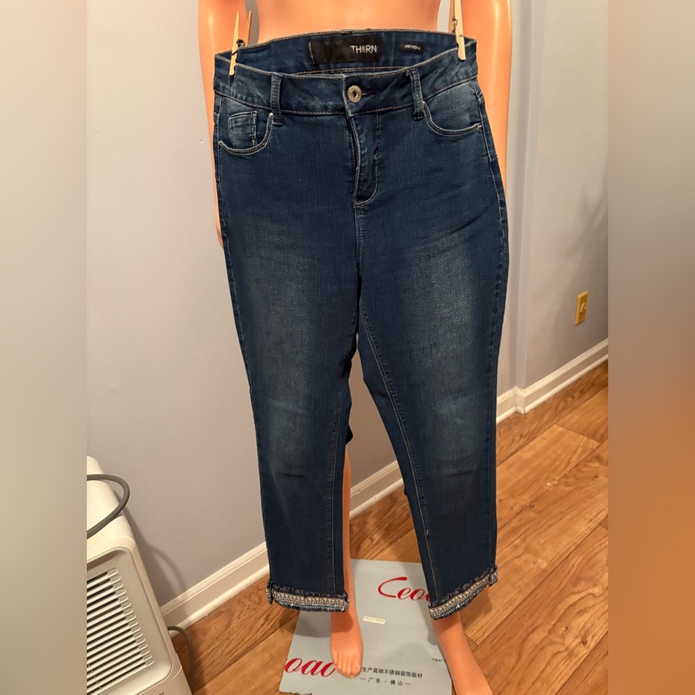 Women's Thorn Blue Jeans with embellished hemline.